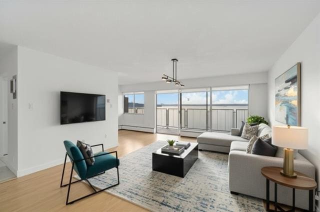 Bright living room with large windows and balcony overlooking West Vancouver.