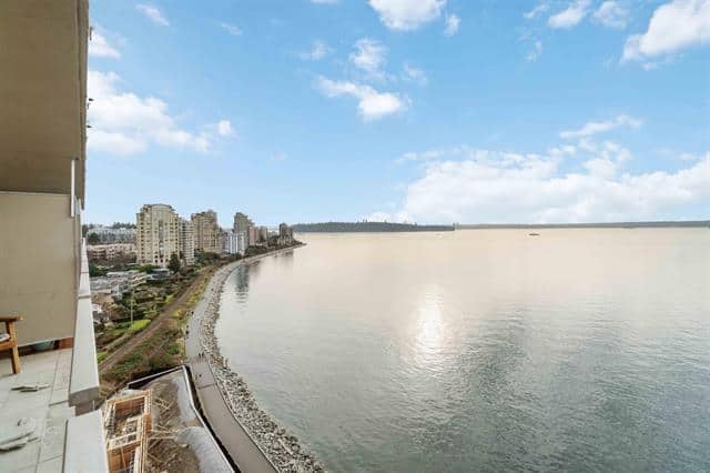 Stunning view of the West Vancouver shoreline and ocean from a high-rise balcony, showcasing the scenic beauty and luxurious living environment.