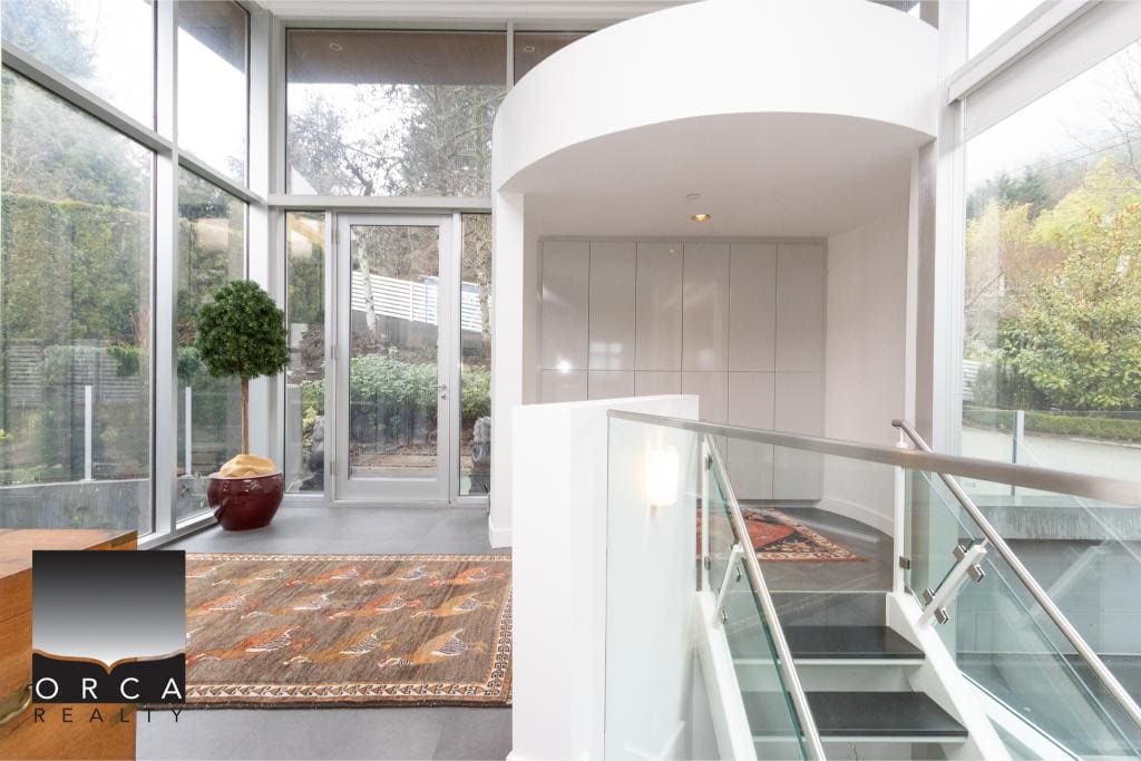 Bright, spacious lobby with large windows and sleek design elements.