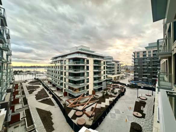 Modern waterfront condo in North Vancouver showcasing contemporary design and scenic views of the harbor.