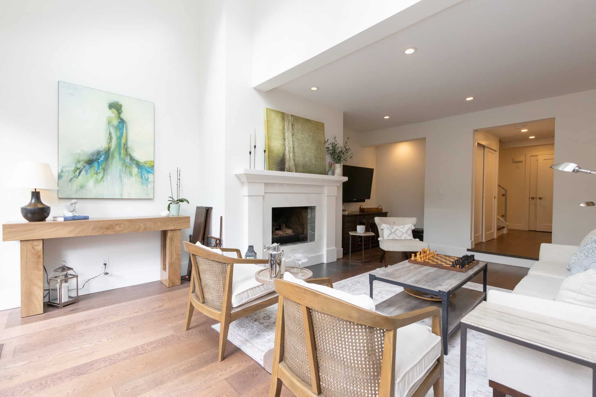 Modern West Vancouver Living Room Bright and spacious living room with contemporary decor and natural light, showcasing a cozy fireplace, stylish furniture, and elegant interior design at 13-4957 Marine Drive.