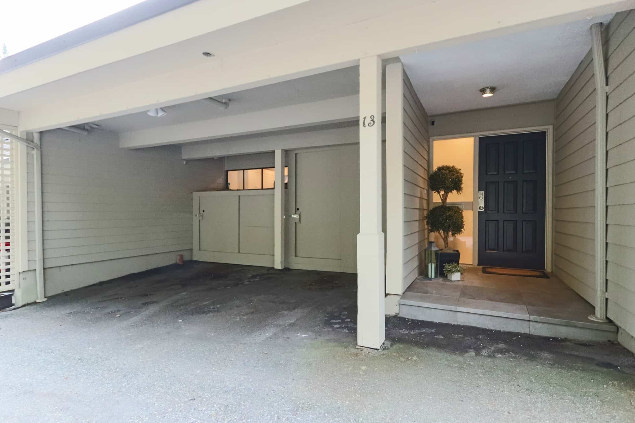 Modern West Vancouver home entrance and garage West Vancouver home entrance with stylish front door and garage, showcasing a well-maintained property at 13-4957 Marine Drive. Perfect for real estate listings and property showcases.