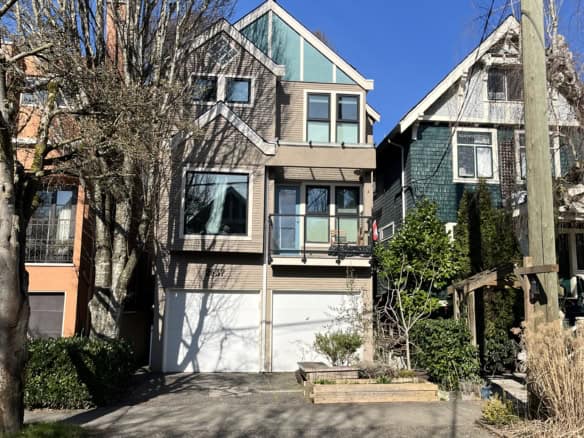 Spacious multi-level house located at 1-2637 West 7th Avenue, Vancouver, featuring contemporary architecture, large windows, and a private garage. Perfect for families seeking a stylish urban residenc.