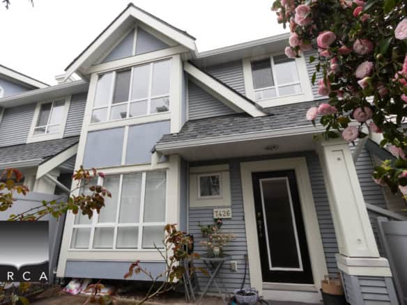 Beautiful exterior view of a contemporary house in Burnaby, showcasing large windows, stylish architecture, and well-maintained landscaping. Perfect for real estate listings and property marketing.
