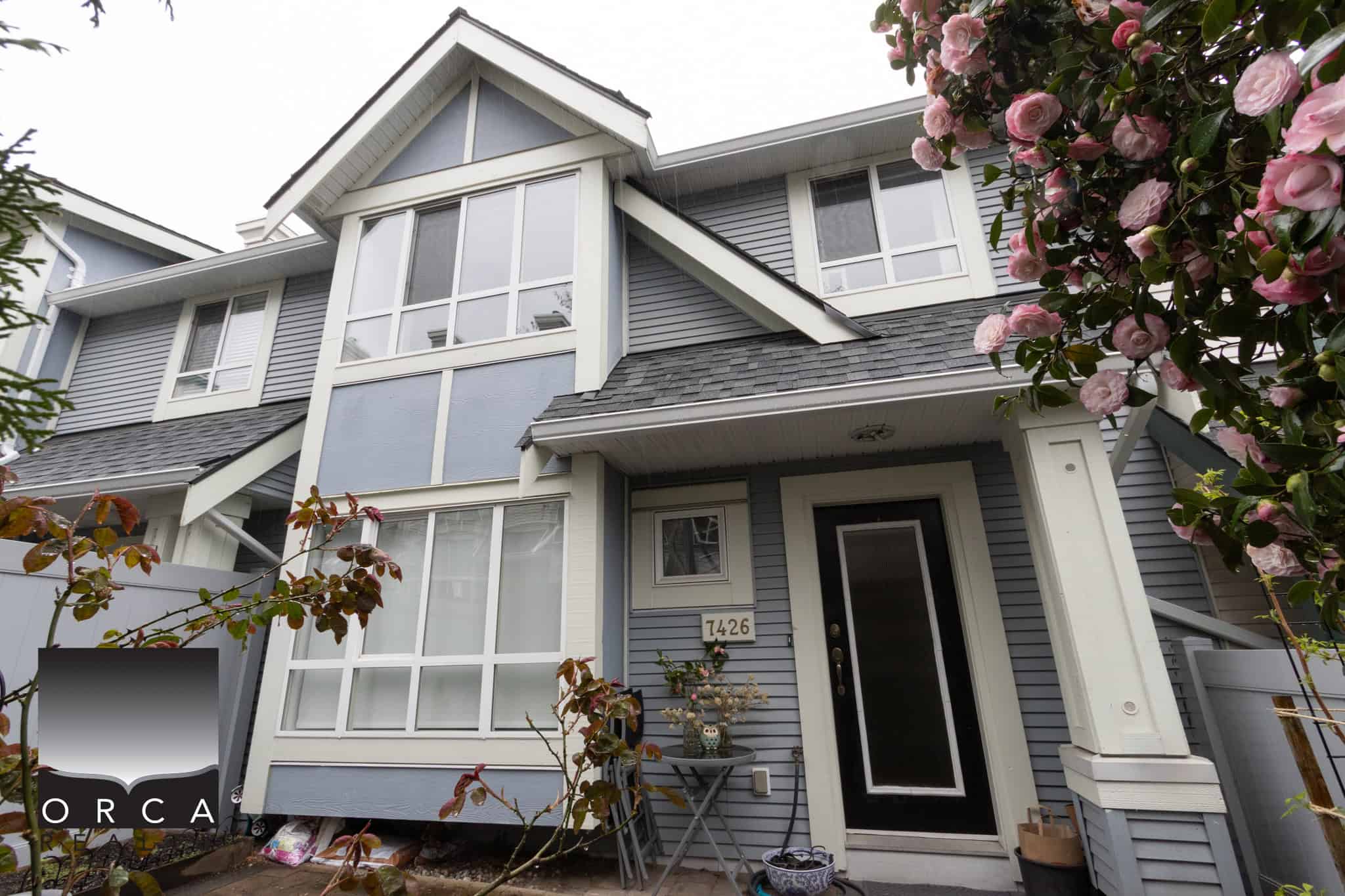 Beautiful exterior view of a contemporary house in Burnaby, showcasing large windows, stylish architecture, and well-maintained landscaping. Perfect for real estate listings and property marketing.