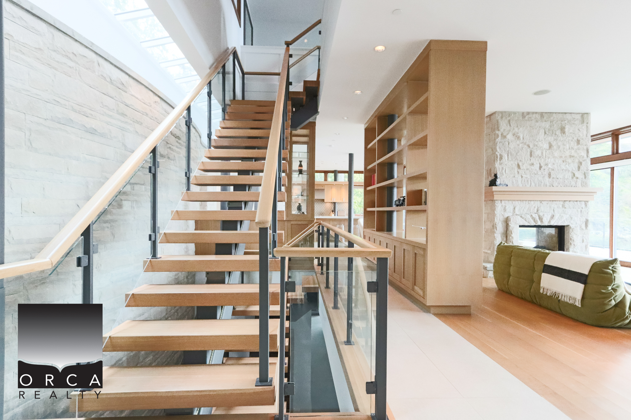 Modern Interior Staircase at 6780 Bachelor Bay Place, West Vancouver Elegant wooden staircase with glass railing in a contemporary home in West Vancouver. Bright, open living space with natural light and stylish decor.