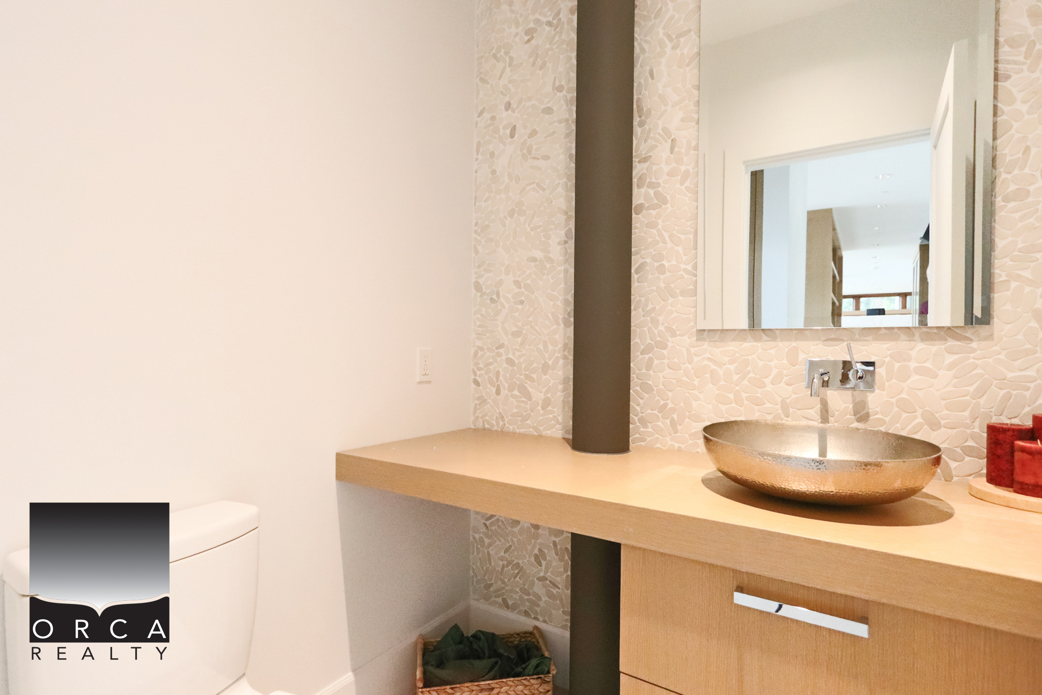 Modern Bathroom Vanity with Vessel Sink in West Vancouver Bright and stylish bathroom featuring a sleek vessel sink on a wooden vanity, with contemporary decor and a large mirror, located at 6780 Bachelor Bay Place, West Vancouver.