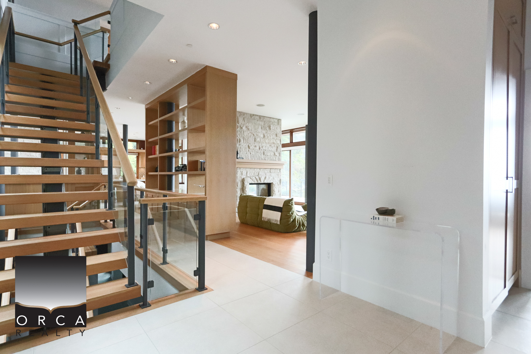 Modern West Vancouver Home Interior Spacious living area with contemporary design, hardwood floors, and large windows offering natural light. Perfect for luxury real estate showcasing at 6780 Bachelor Bay Place.