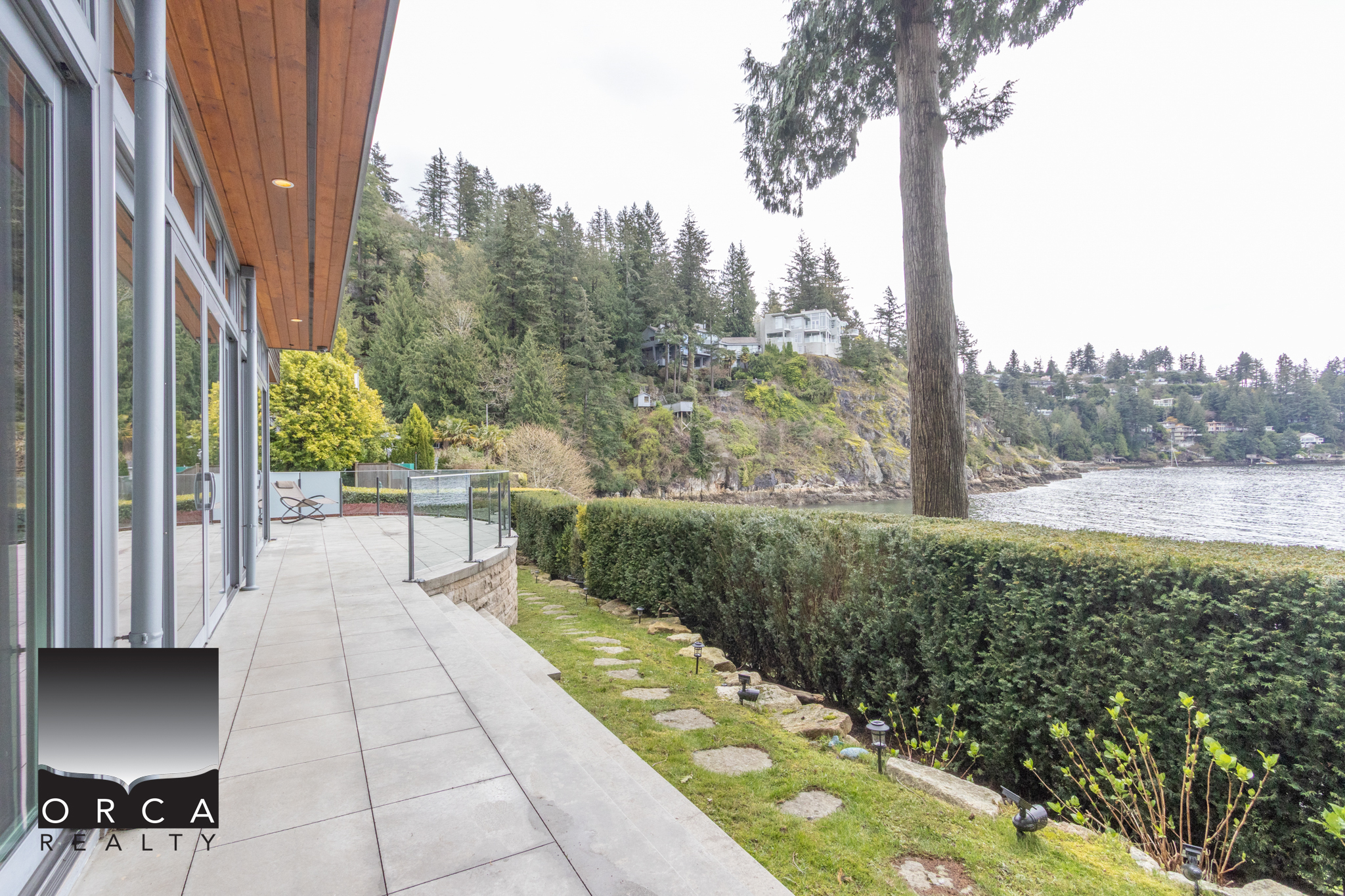 Modern West Vancouver Waterfront Home Beautiful waterfront property at 6780 Bachelor Bay Place, West Vancouver, showcasing stunning views and luxurious outdoor living spaces.