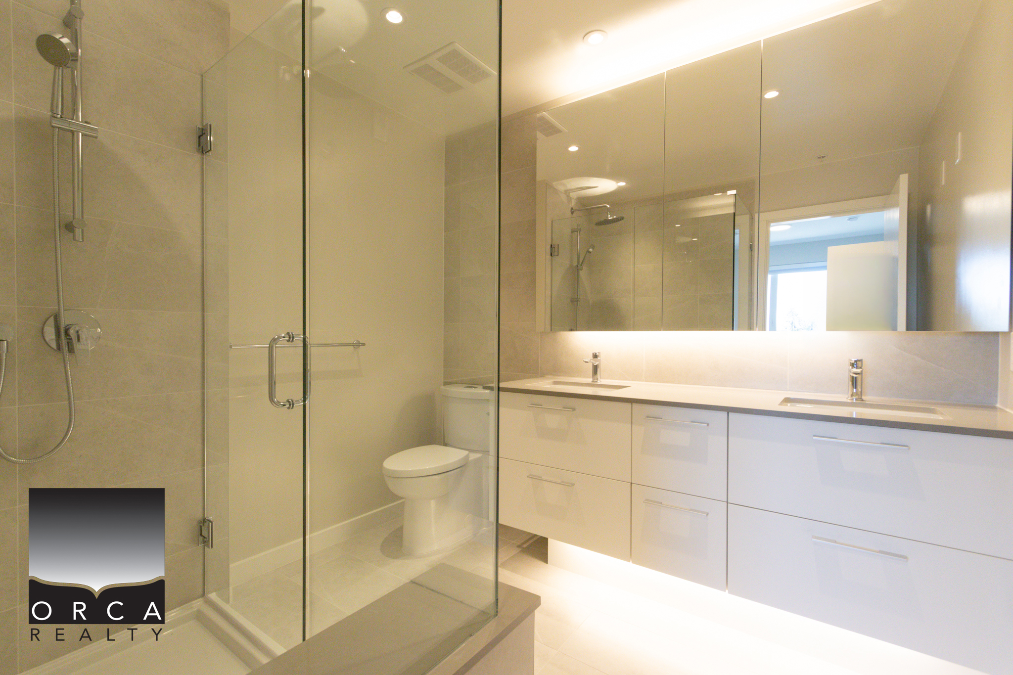 Modern Bathroom with Glass Shower and Vanity Contemporary bathroom featuring a glass-enclosed shower, sleek white vanity, and modern fixtures, ideal for luxury home living in Vancouver.