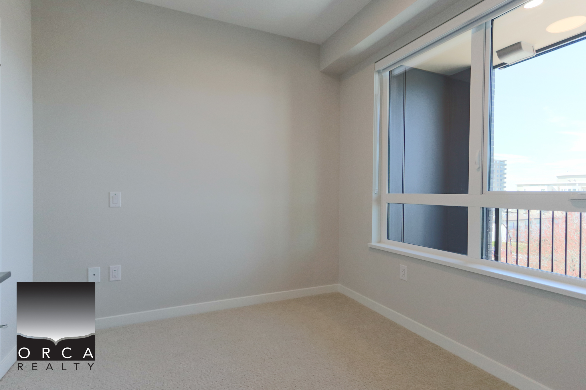 Modern Empty Room with Large Window in Vancouver Bright, spacious empty room featuring a large window with city views, ideal for Vancouver real estate listings. Perfect for showcasing property interiors to attract potential buyers.