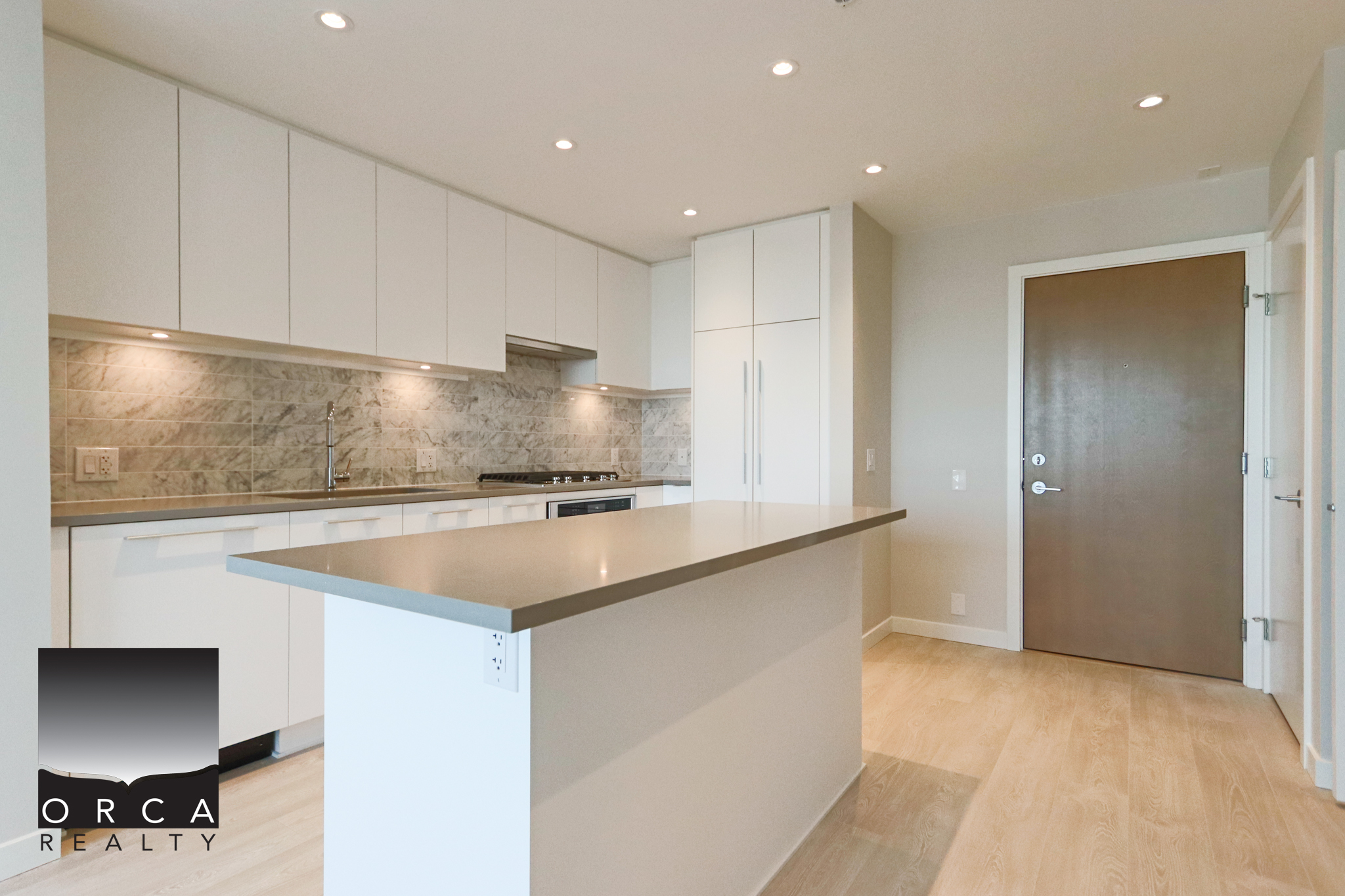 Modern Kitchen with White Cabinets and Island Bright, contemporary kitchen featuring white cabinetry, a spacious island, and sleek countertops, ideal for modern home living in Vancouver.