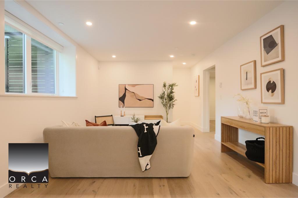 Bright and inviting living room with contemporary decor, large window, and minimalist design, perfect for relaxing or entertaining in a stylish home.