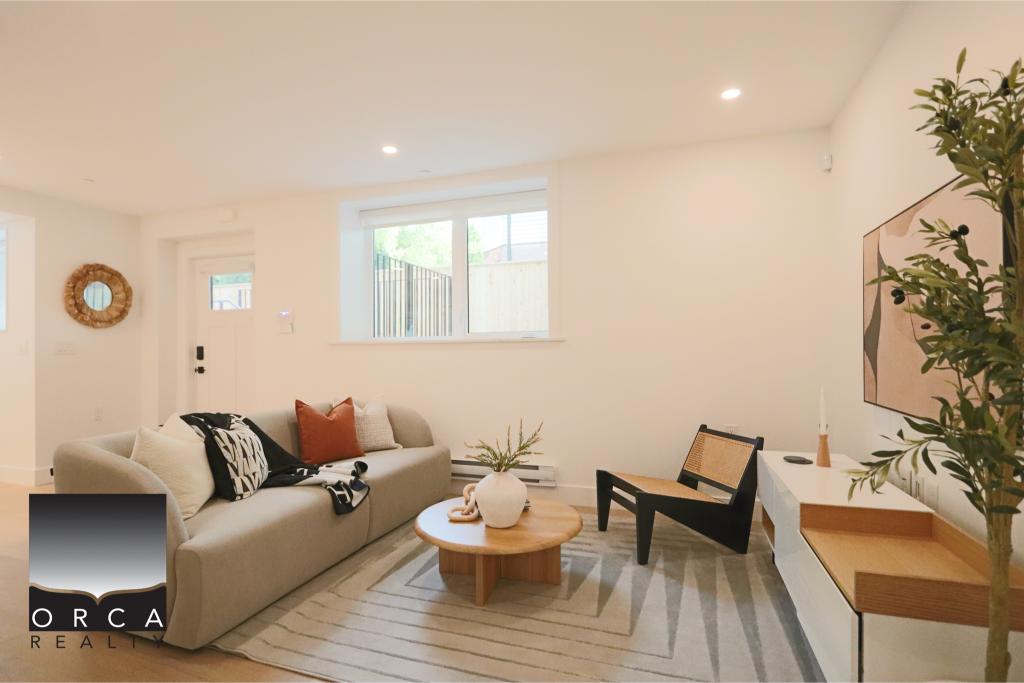 Bright and airy living room featuring a neutral color palette, contemporary furniture, and large windows that bring in natural light, perfect for a cozy home setting.