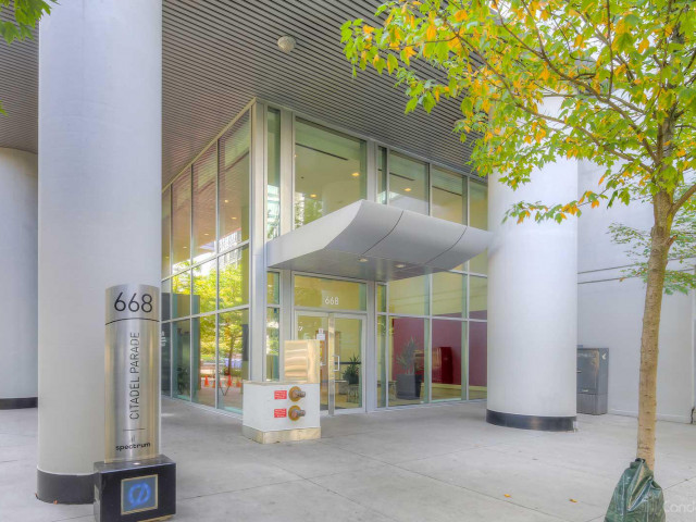 Modern commercial building entrance with glass facade and white cylindrical columns, located at 668 Citadel Parade, Vancouver, BC.