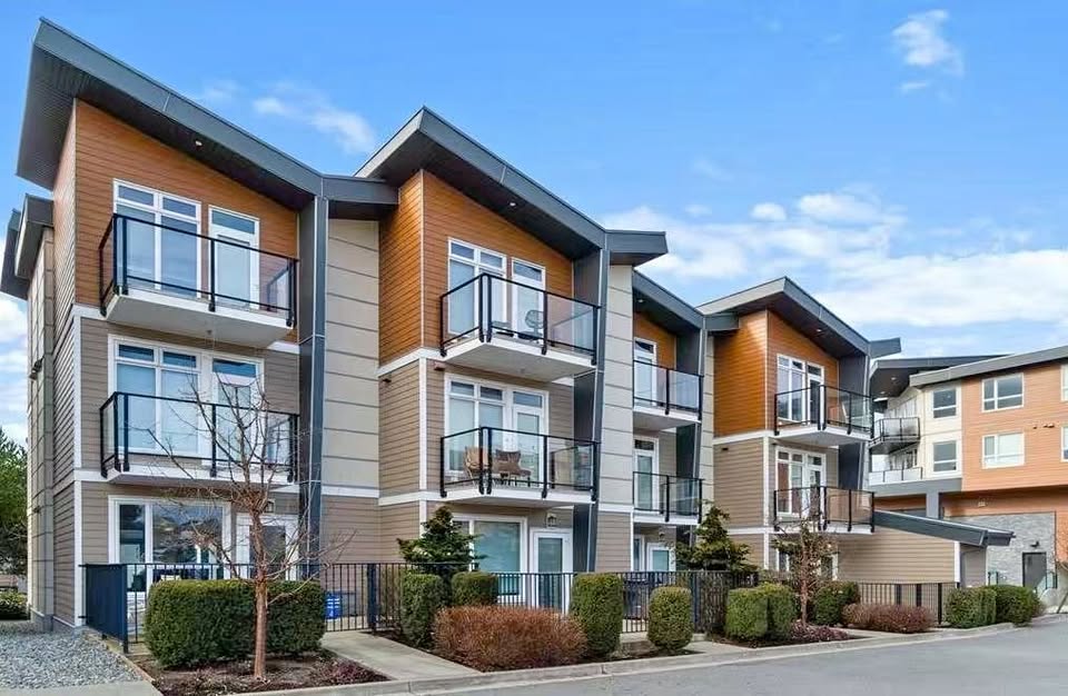 Contemporary apartment complex with multiple balconies and landscaped surroundings in Nanaimo, BC.