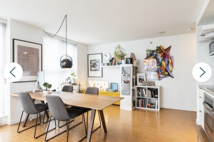 Bright and modern Vancouver condo interior with dining area, artwork, and decorative shelves, showcasing contemporary home design.