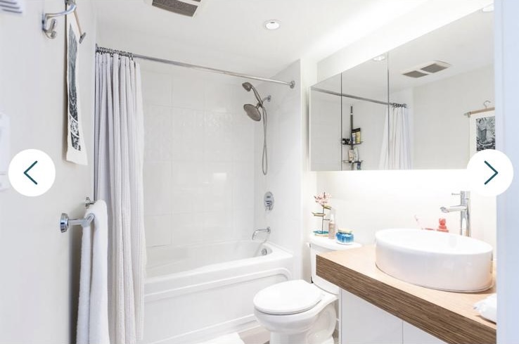 Contemporary bathroom with white tiles, a bathtub, and a stylish vanity with a vessel sink in Vancouver.